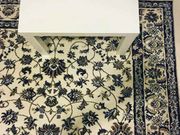 Can you find an iPhone dropped on this floral carpet?
