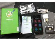 Moto G5 along with retail box, removable battery, and accessories caught in images