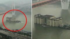 வைரல் வீடியோ: ஆற்றில் மிதந்து சென்ற 5 மாடி கட்டிடம்! காரணம் இதுதான்!