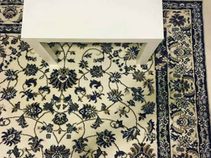 Can you find an iPhone dropped on this floral carpet?