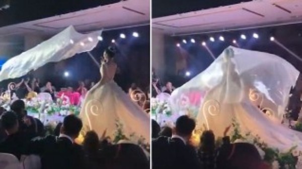 शादी के गाउन का उड़ता हुआ घूंघट