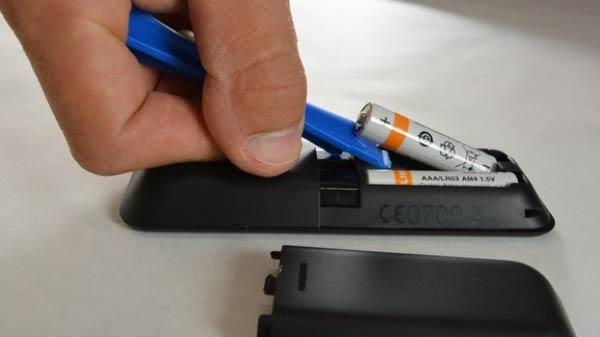 REMOVE BATTERY FROM REMOTE