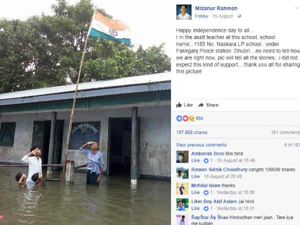 ఇద్దరు చిన్నారులు భుజాల వరకు వరద నీరు ఉన్నప్పటికీ